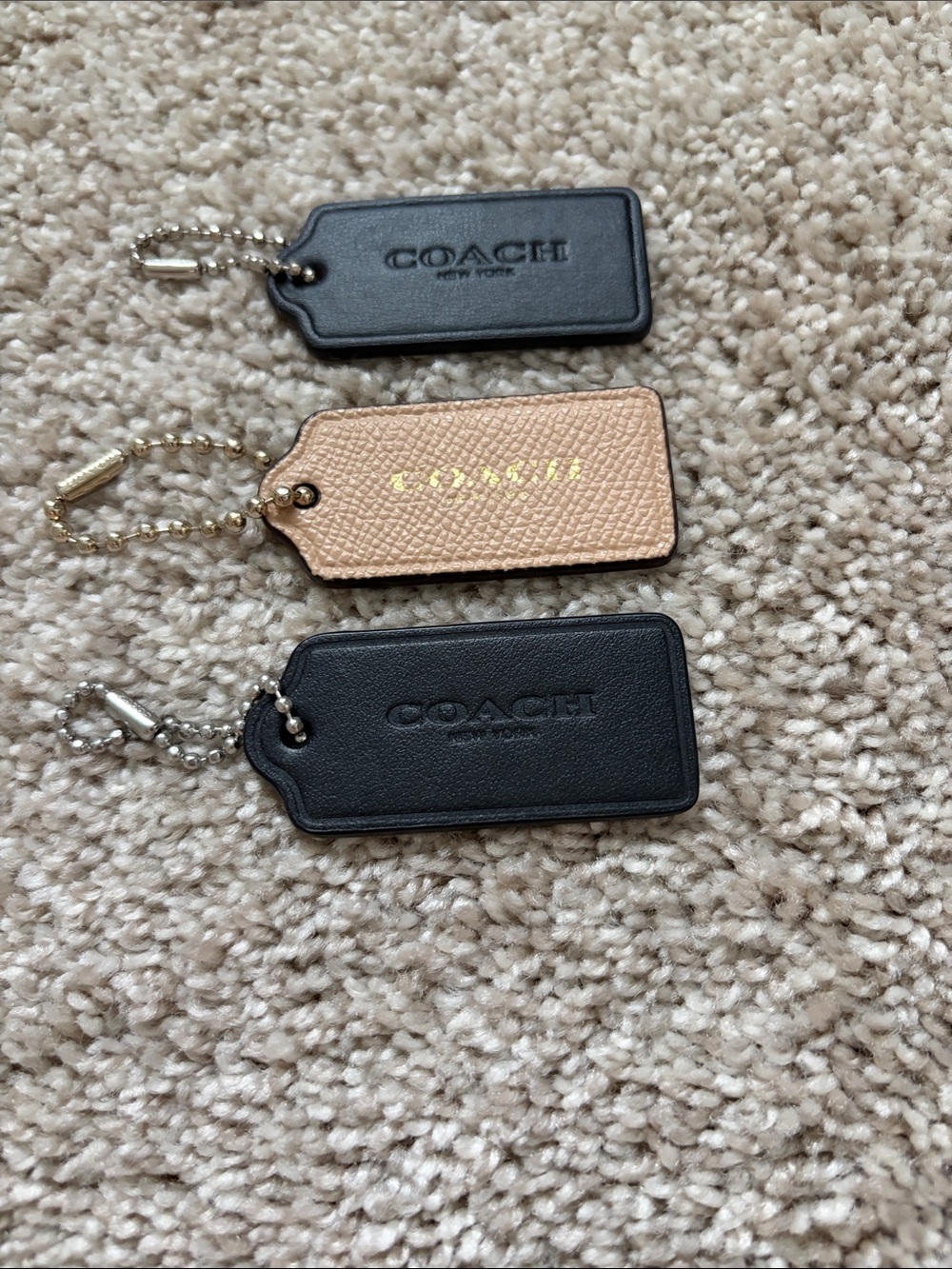 COACH Black and Beige Leather Tag Keychain Trio
